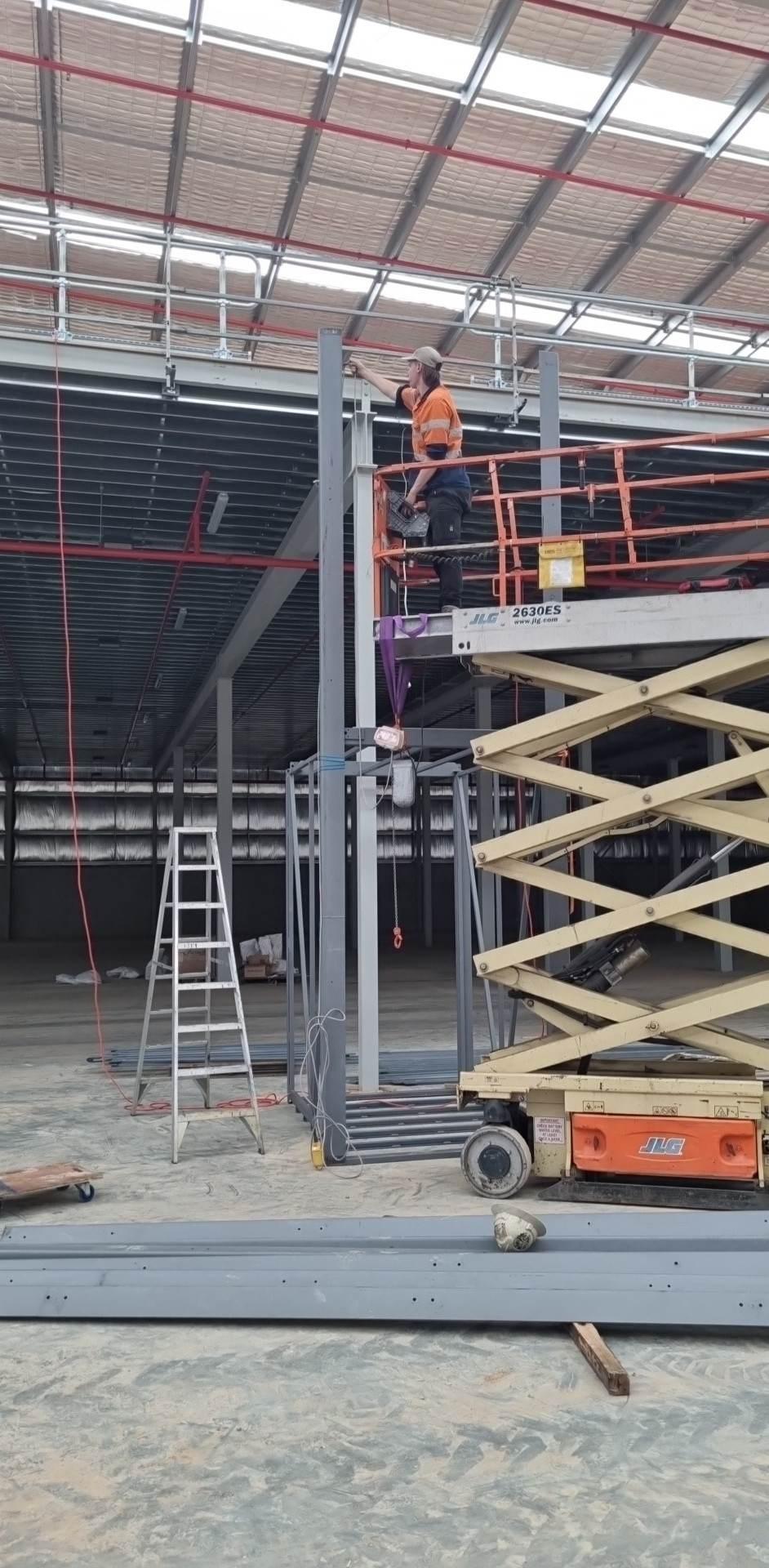 TLS installers working at height on the shaft columns