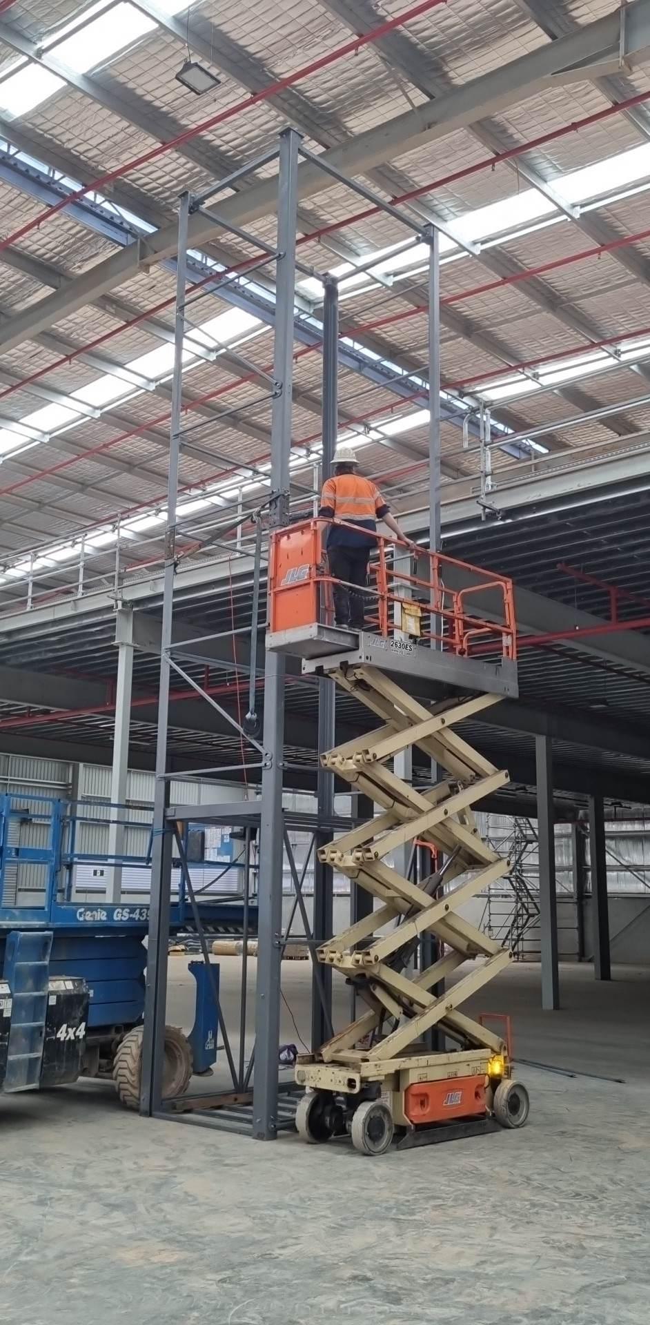 The goods lift tower reaching full height