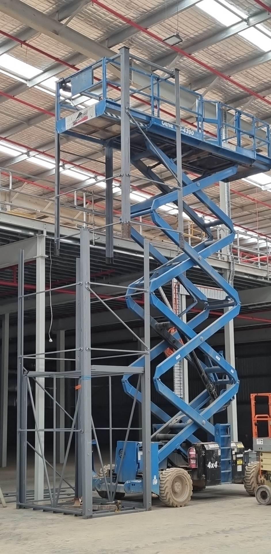 Scissor lift working alongside the hoist shaft