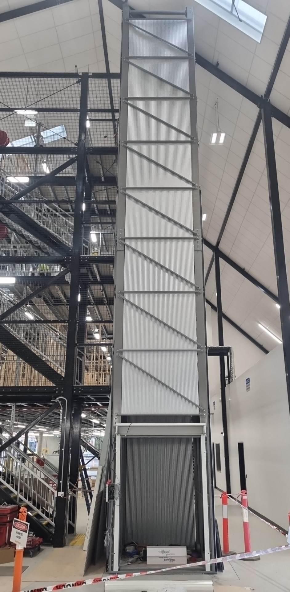 The finished four-stop goods lift, clad and commissioned