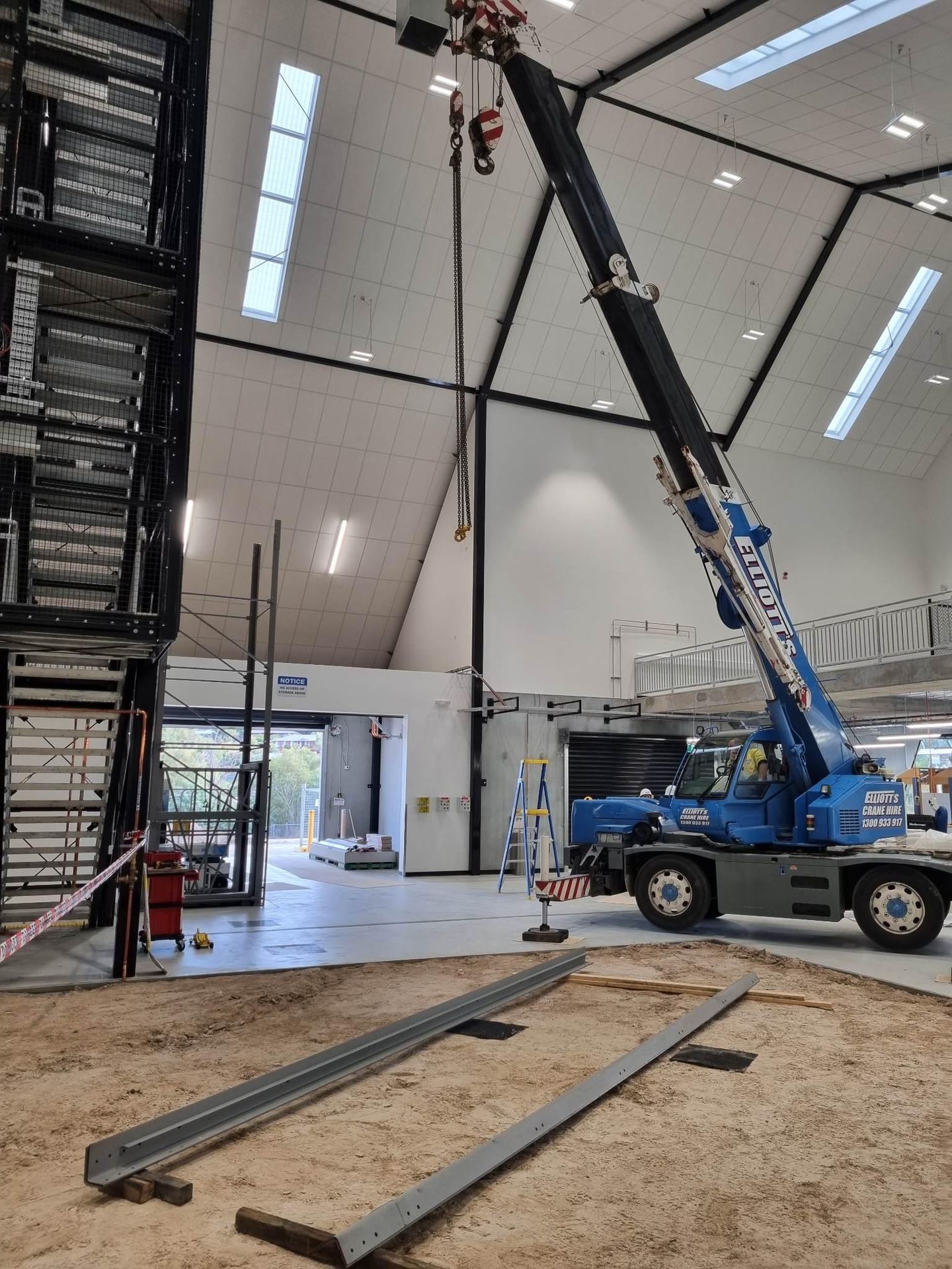 Guide rails laid out as the crane positions the shaft steel