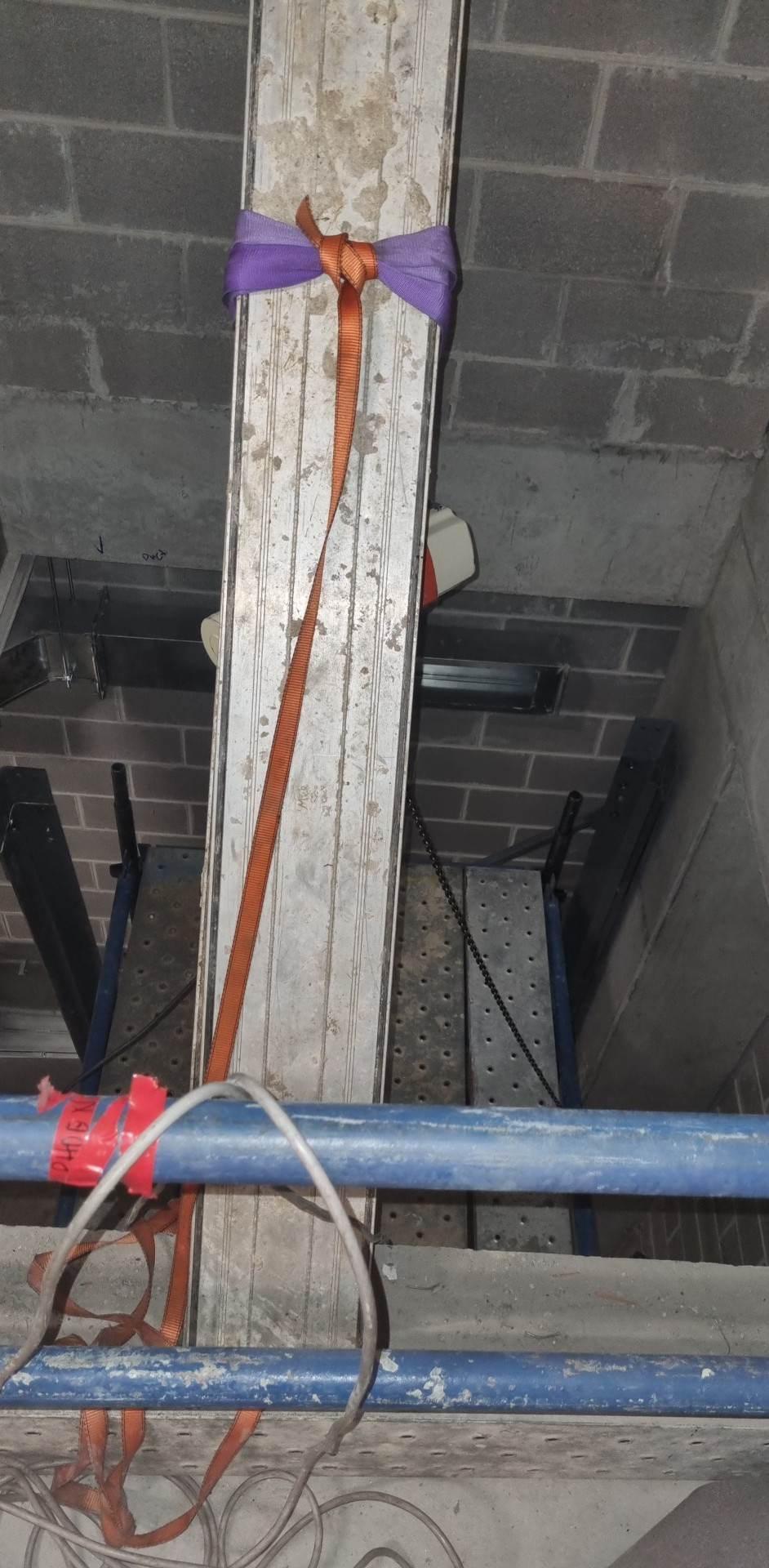 Rigging the goods lift column inside the masonry shaft