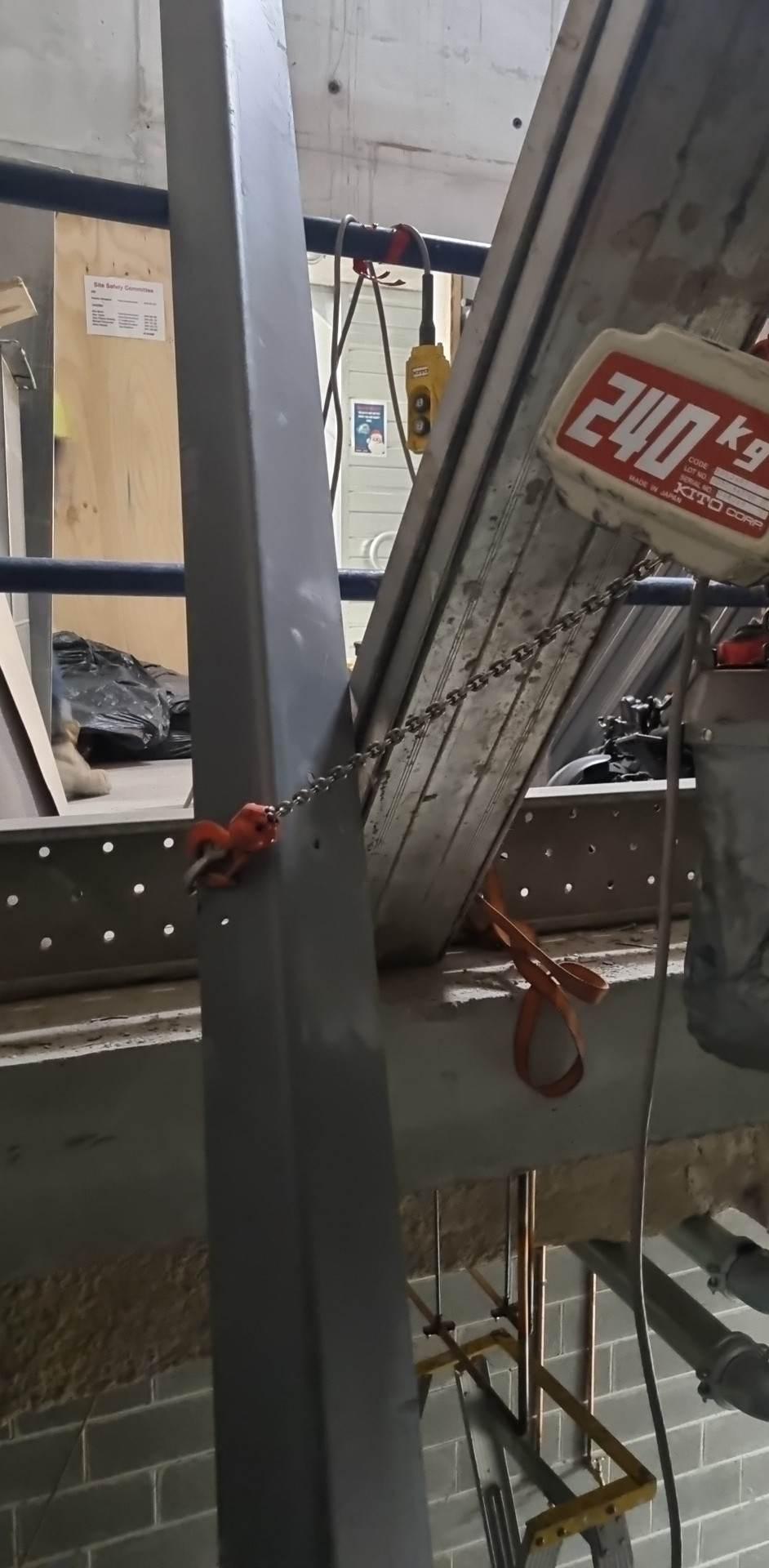Chain hoist rigged for lifting the shaft steel into place