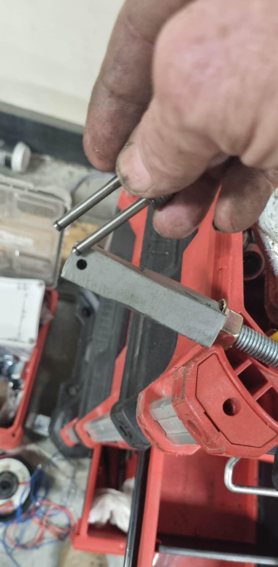 Fitting pins during the goods lift guide assembly