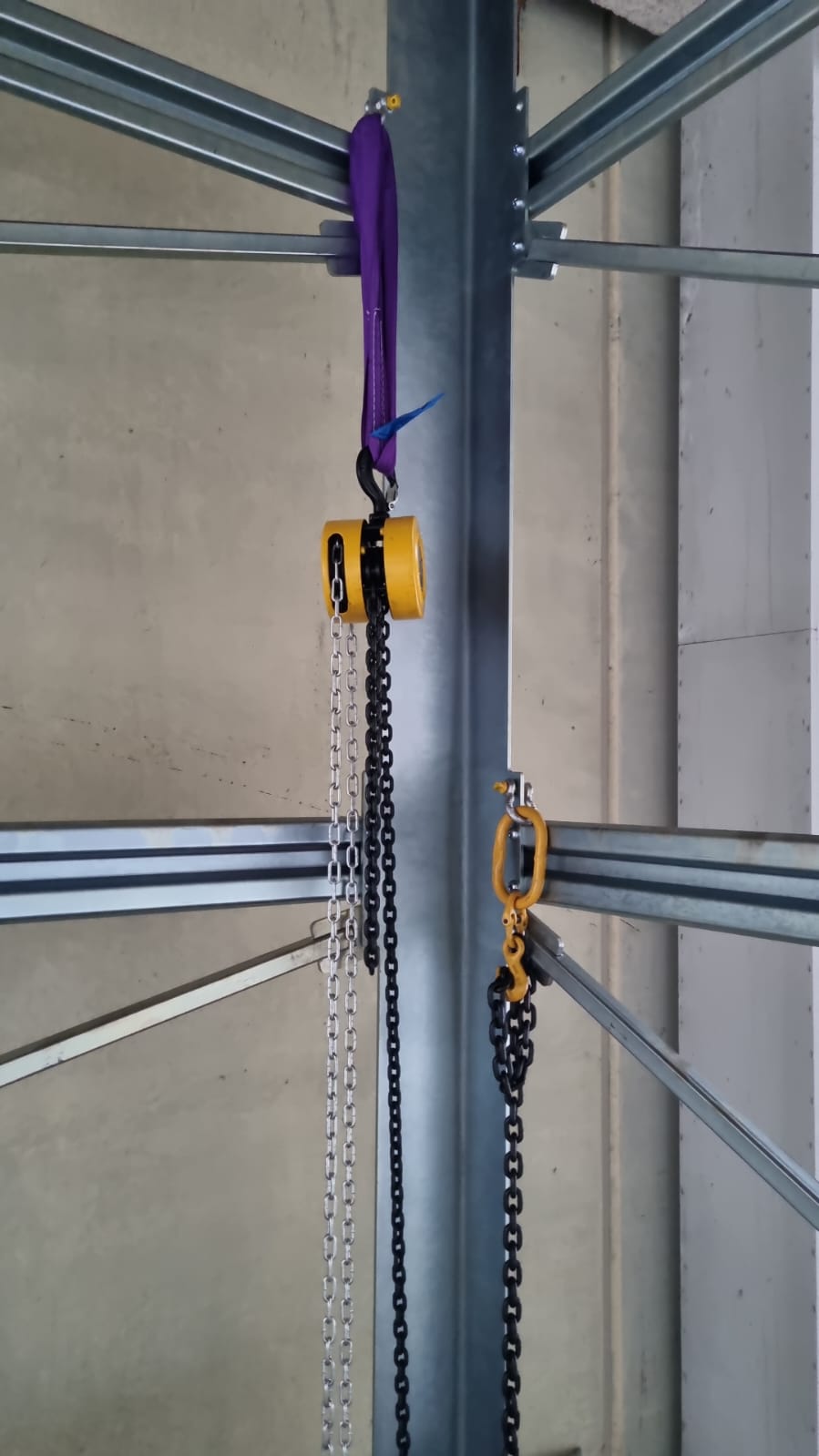 The galvanised shaft rising, rigged with chain blocks