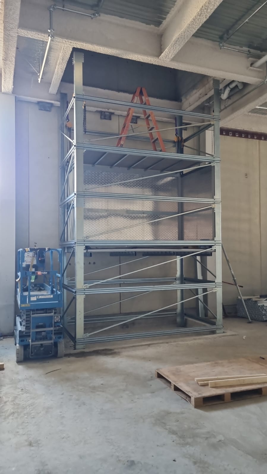 The braced shaft frame standing in the service corridor